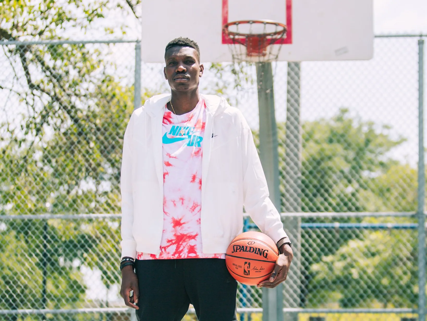 Chris Boucher standing with a basketball